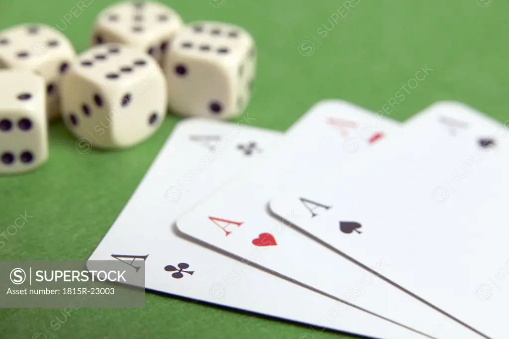 Dice and three aces, close-up