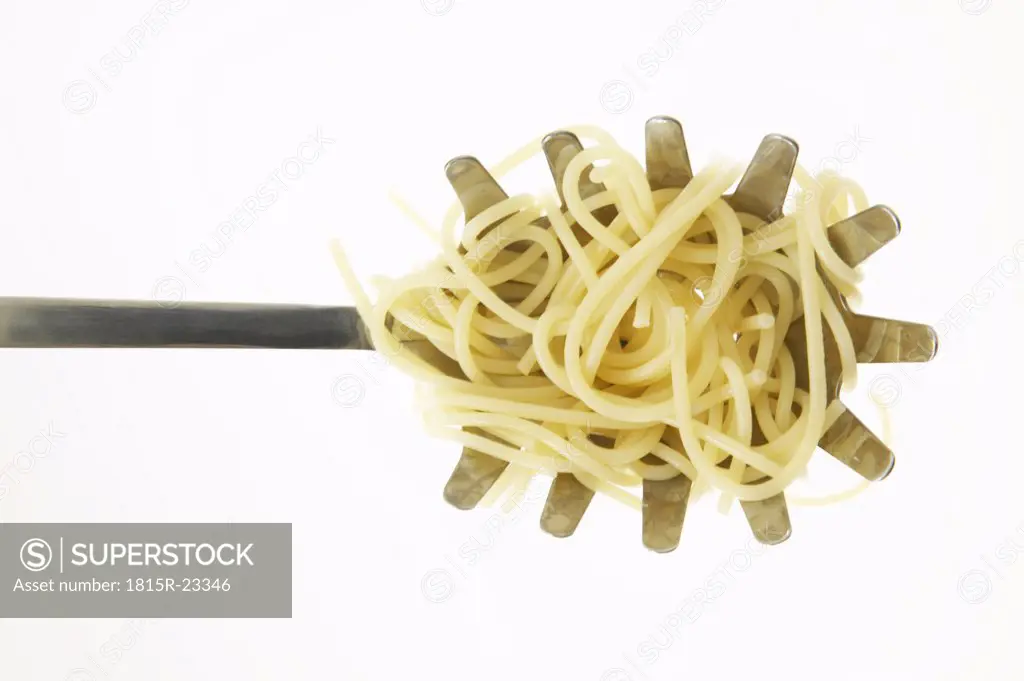 Spaghetti on dipper, close-up