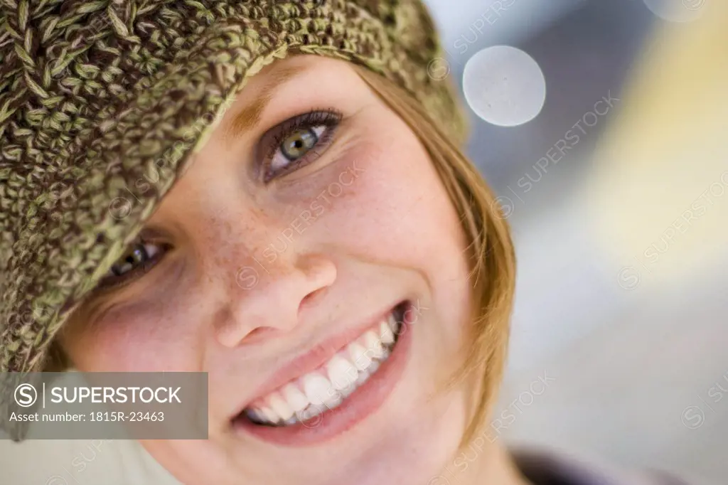 Young woman wearing cap, portrait