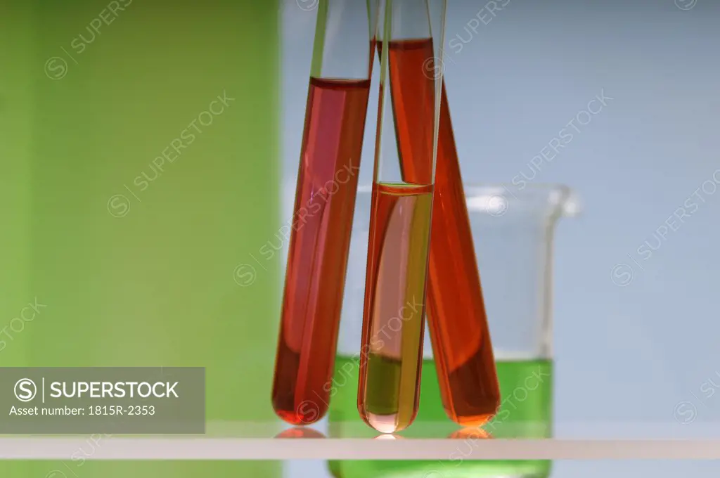 Test tubes with coloured liquid, close-up