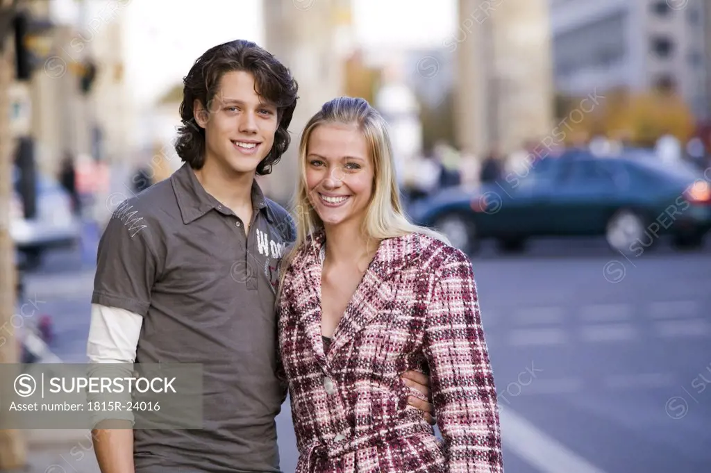 Couple in street, embracing