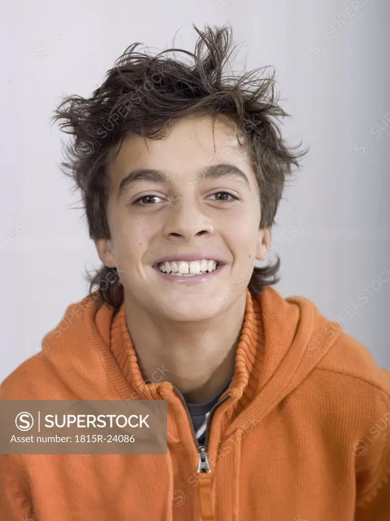 Boy (14-15) smiling, portrait