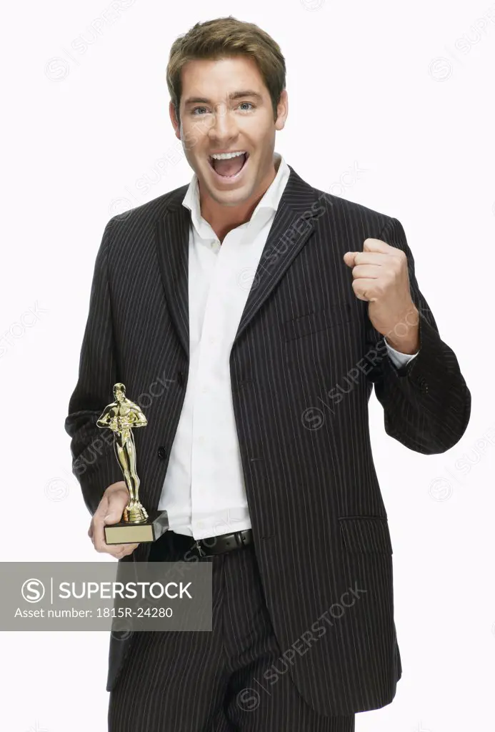 Young man with film award, cheering, portrait