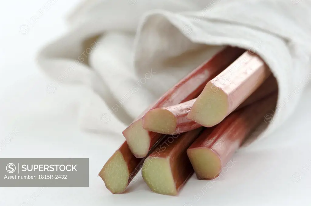 Fresh rhubarb wrapped in cloth, close-up
