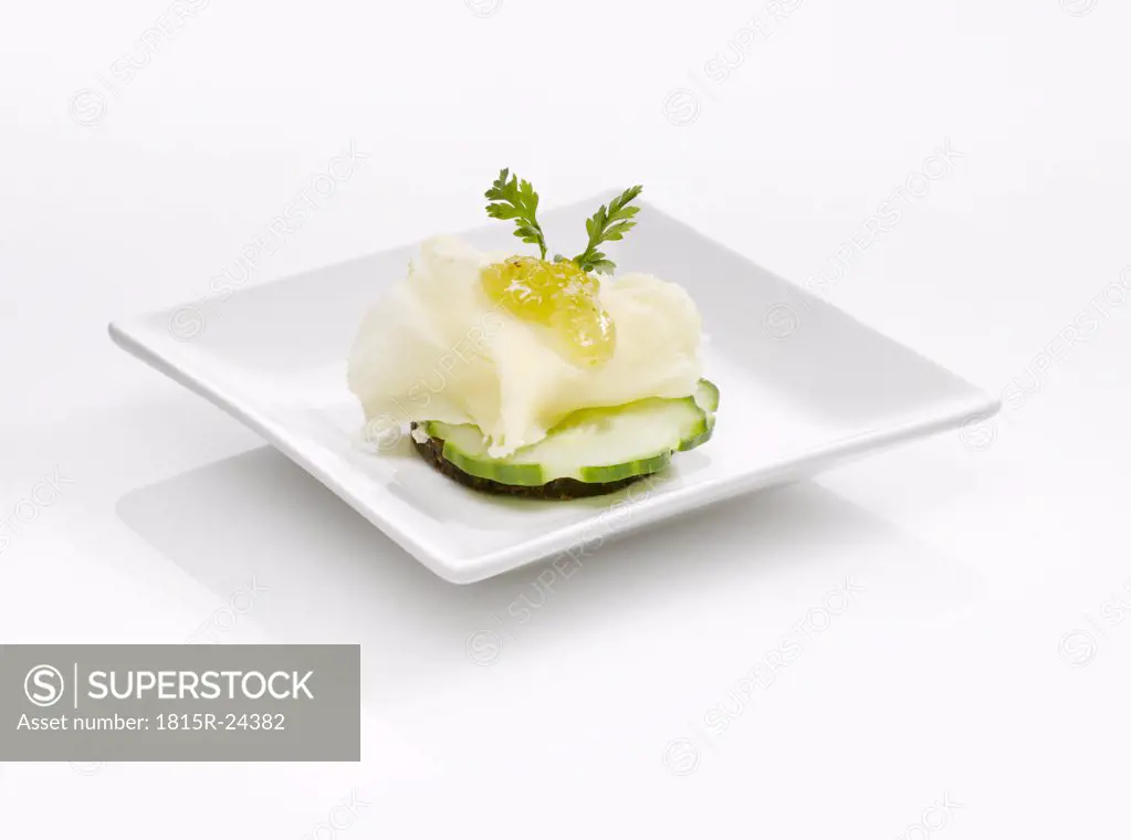 Cream cheese and cucumber slices on plate