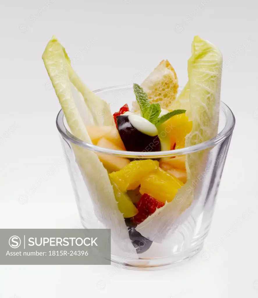 Fruit salad with lime mayonnaise in glass