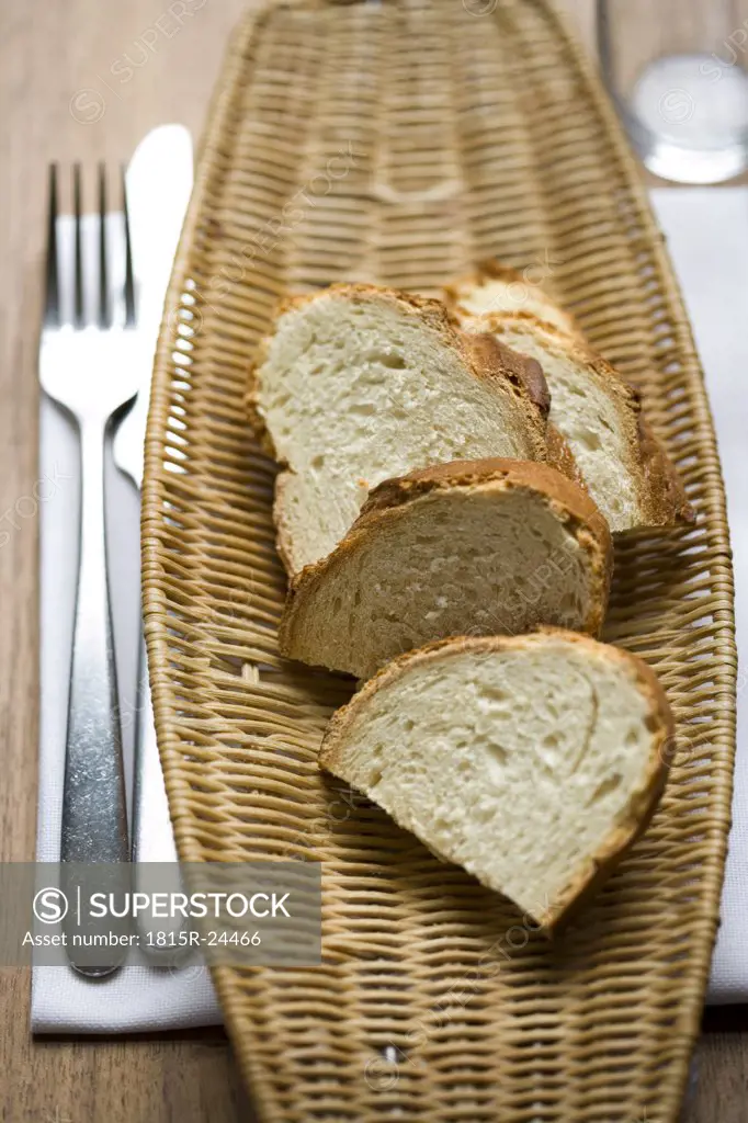 Slices of bread on tray at table, elevated view