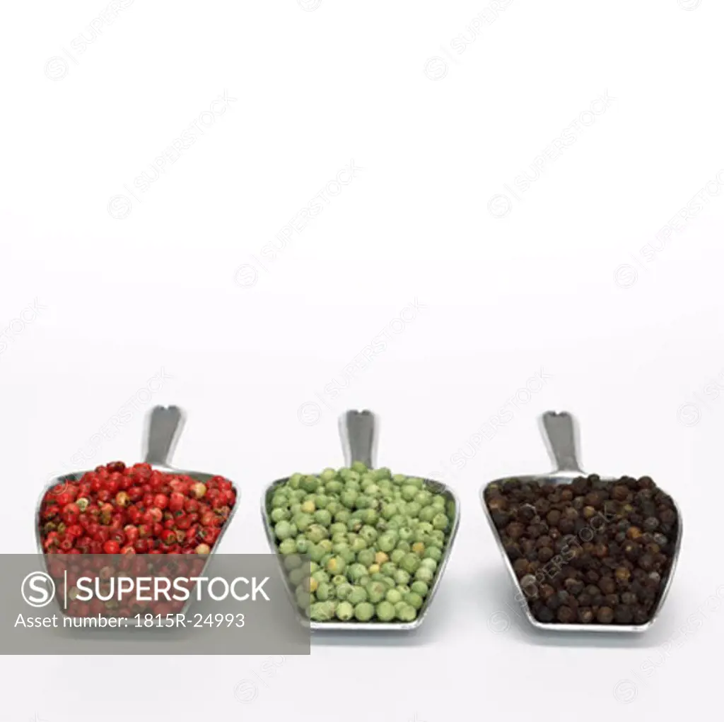 Three type of peppercorns in scoop, close-up