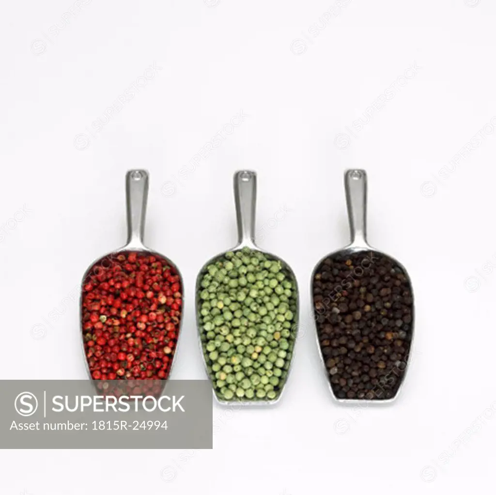 Three type of peppercorns in scoop, close-up