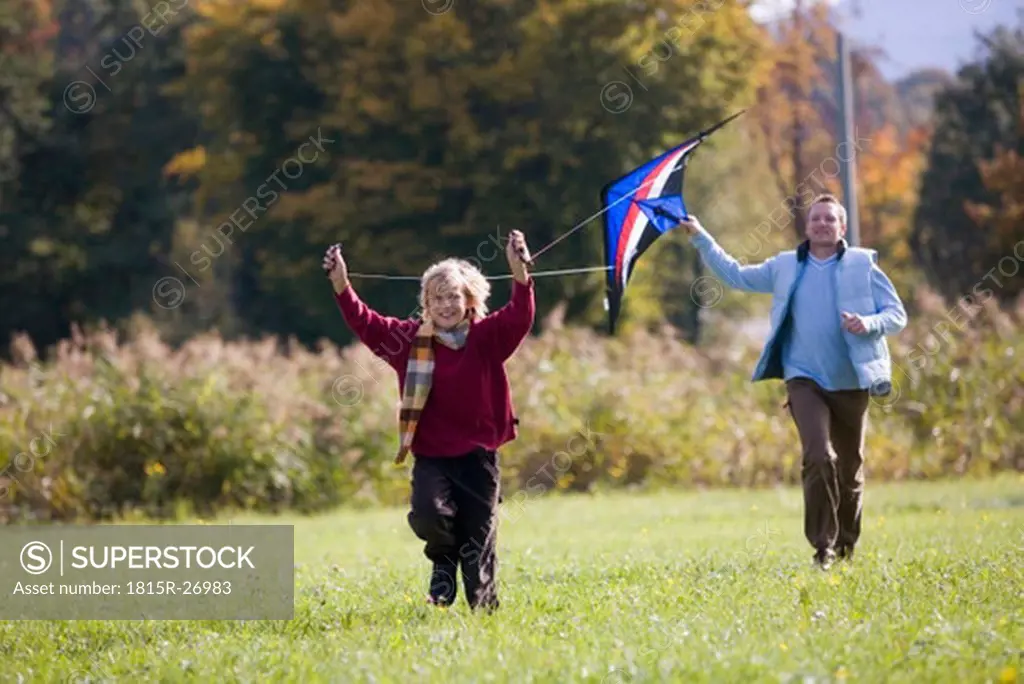 Father and son flying kite