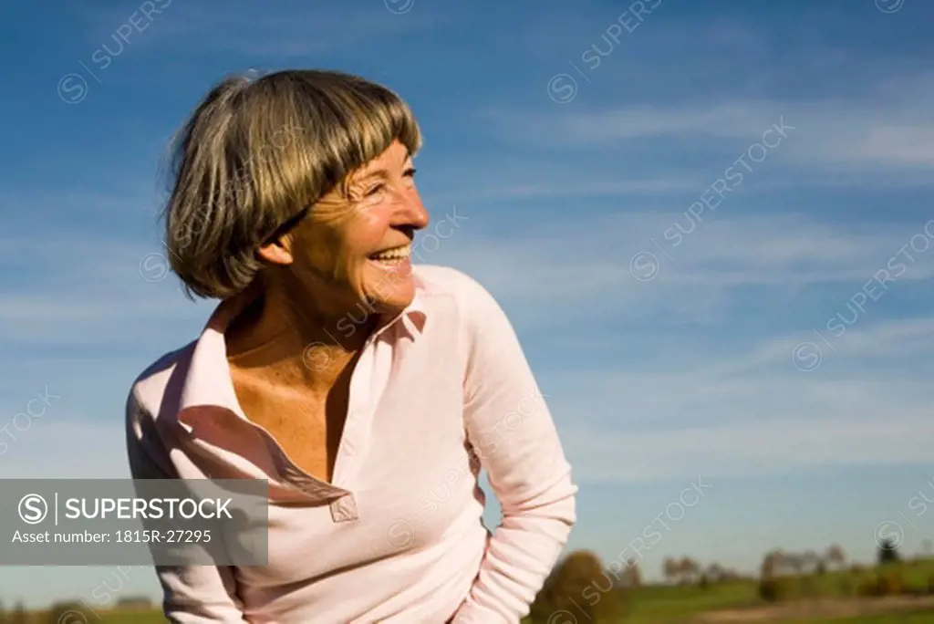 Senior adult woman, looking away, close-up