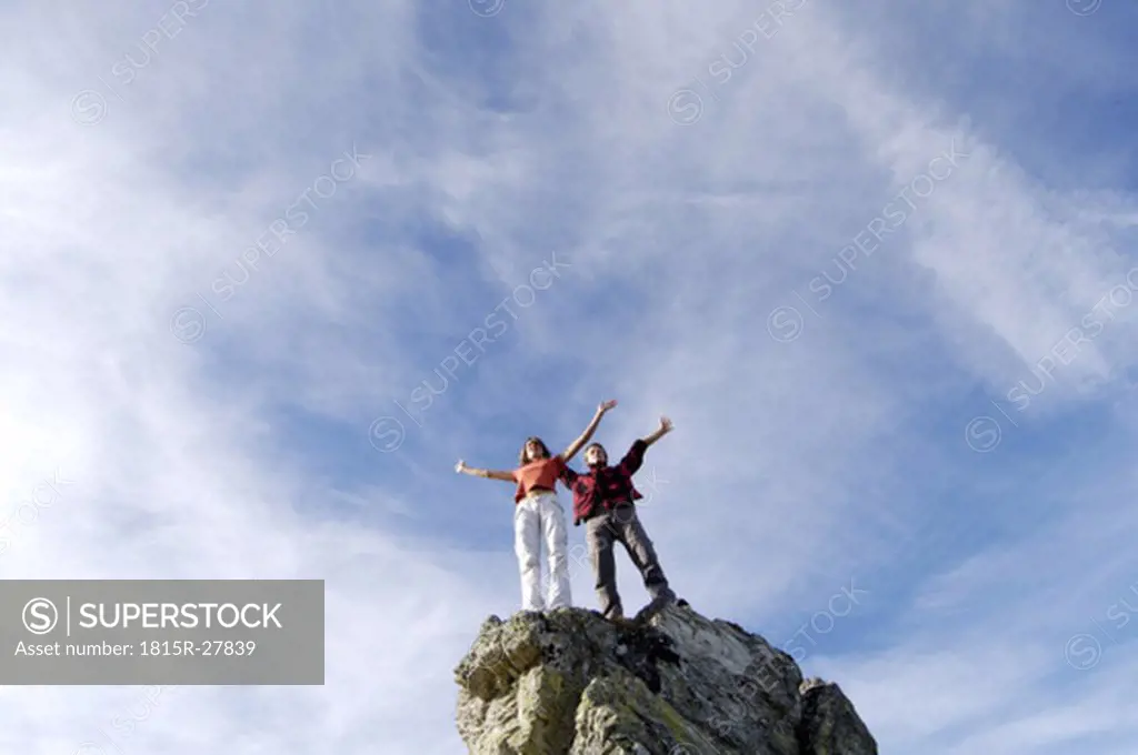 Couple standing on summit