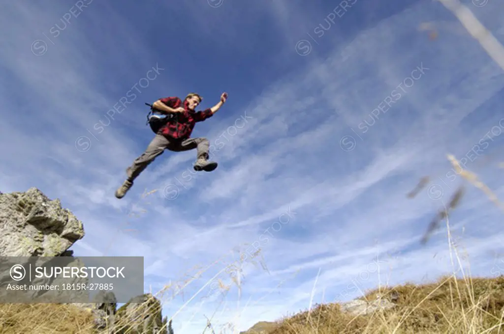 Man jumping in mountains