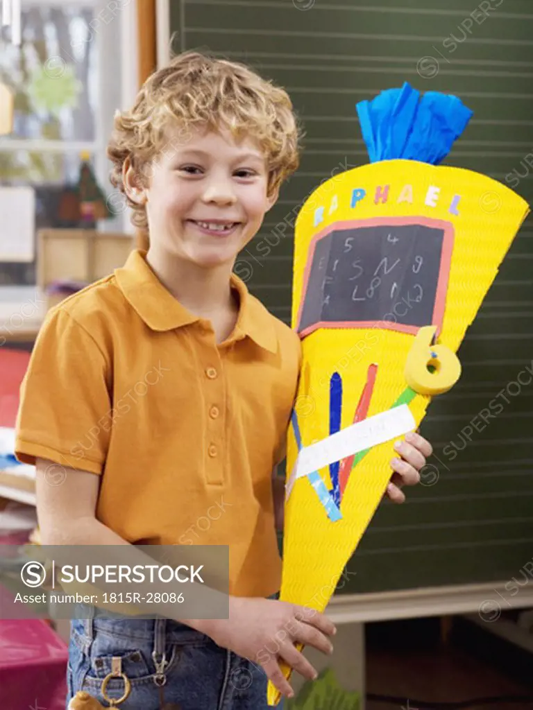 Boy holding schoolcone