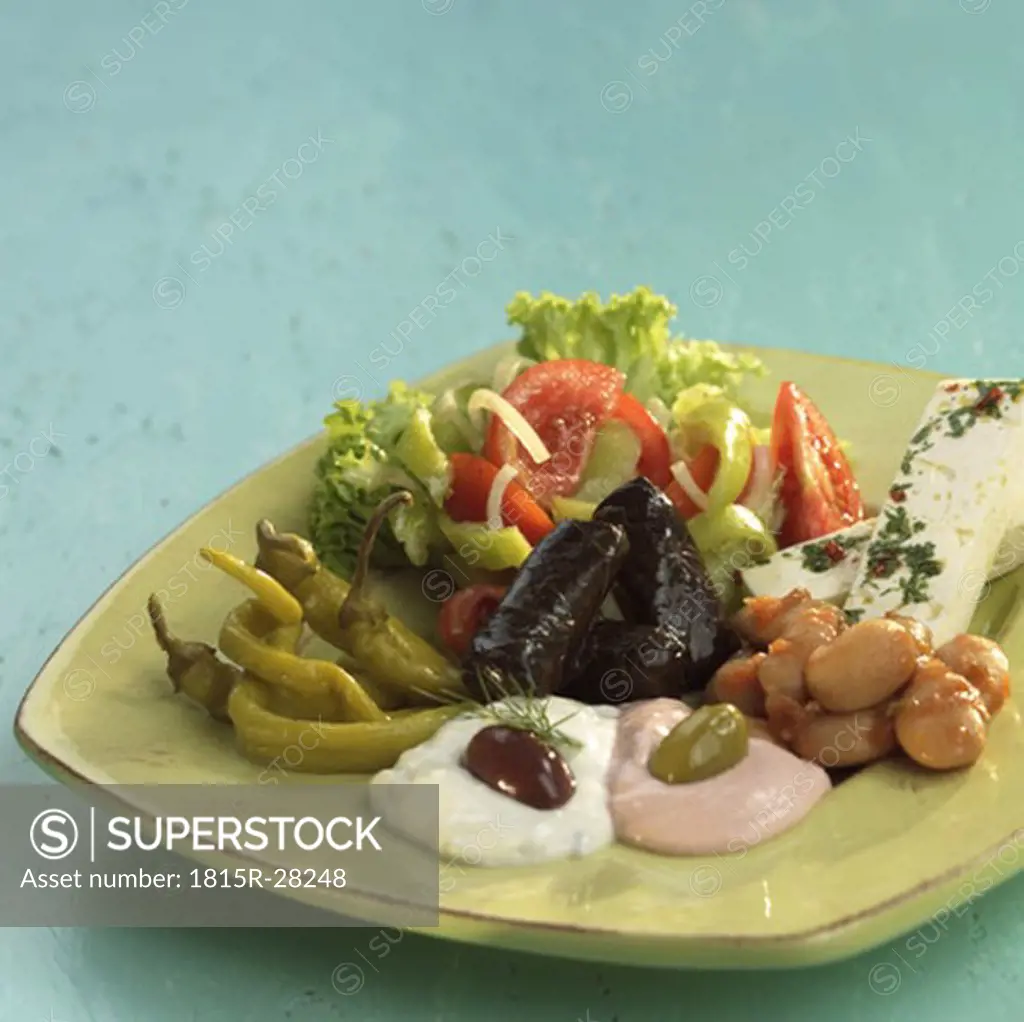 Greek starters, feta cheese, taramas, tsatsiki and pickled vegetables
