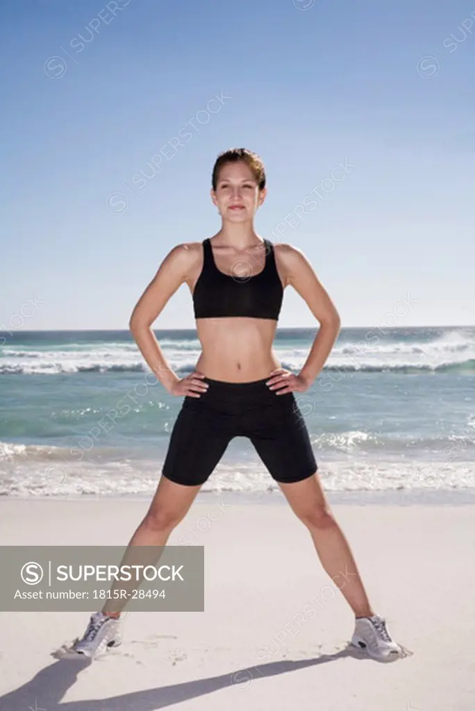 Woman exercising on beach