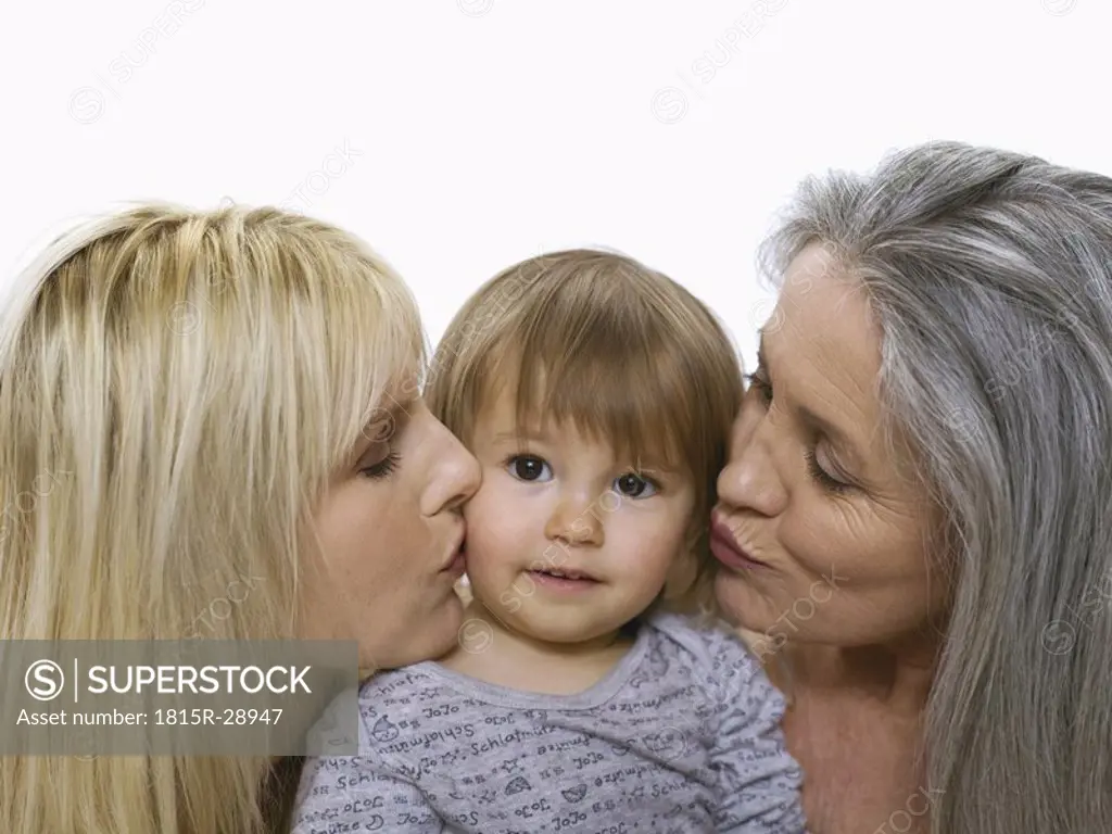 Grandmother and mother holding baby girl, portrait