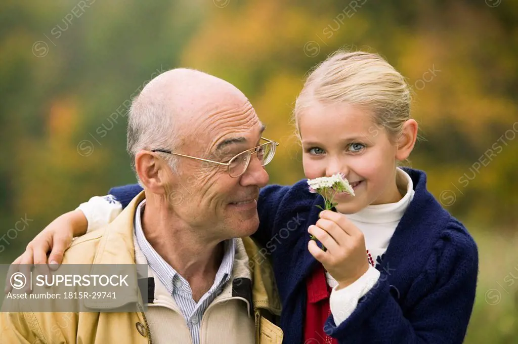 Germany, Baden-Württemberg, Swabian mountains, Grandfather and granddaughter, portrait