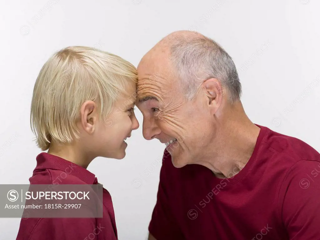 Grandson 8-9 and grandfather, portrait, close-up