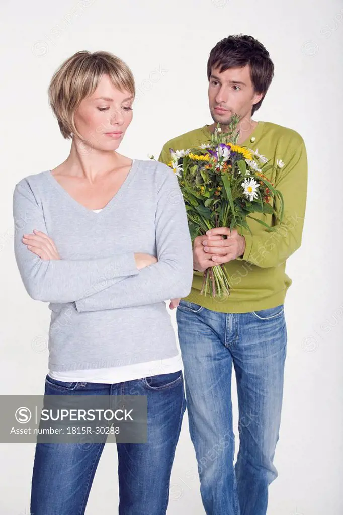 Young couple, man with flowers, portrait