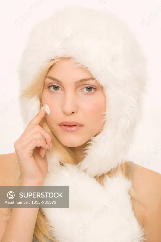 Young woman wearing a fur cap, portrait
