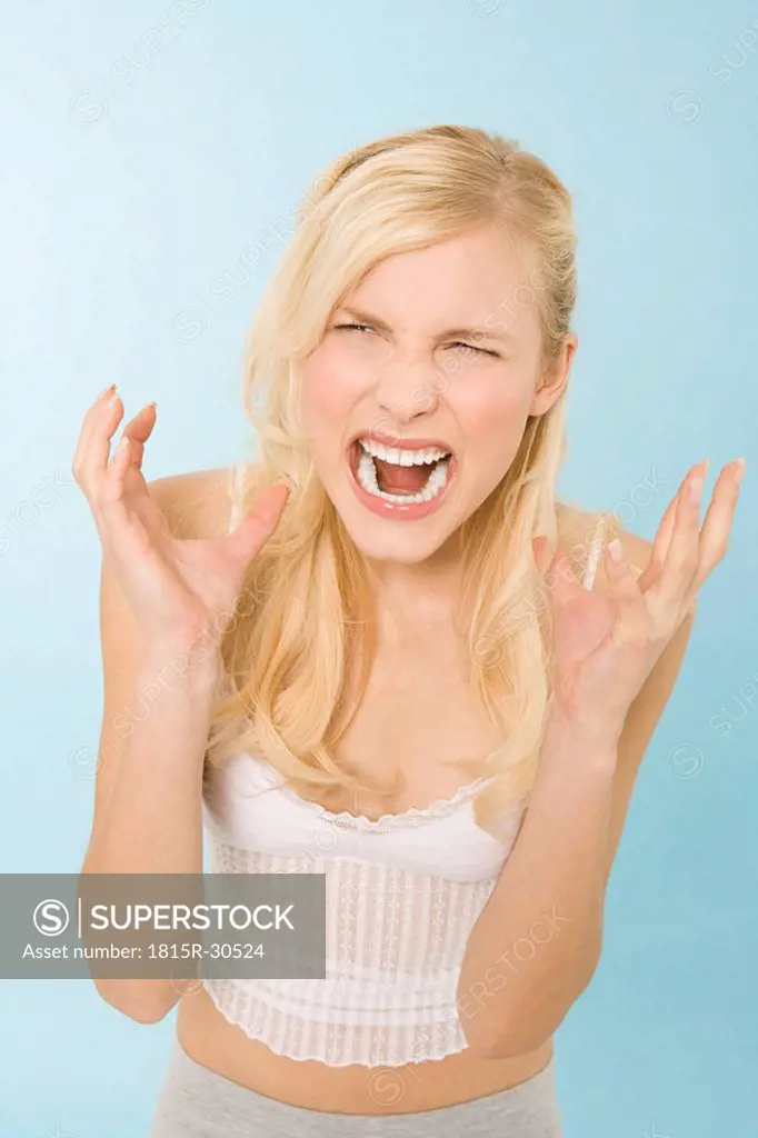 Young woman yelling, portrait