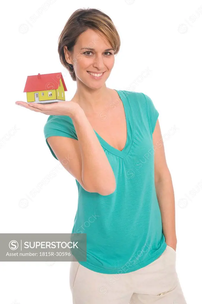 Woman holding house