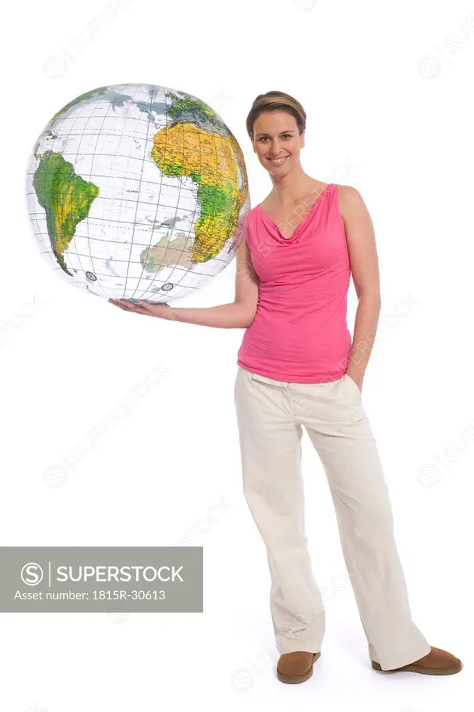 Woman holding inflatable globe