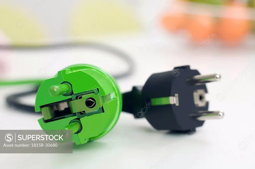 Black and green plugs, close_up