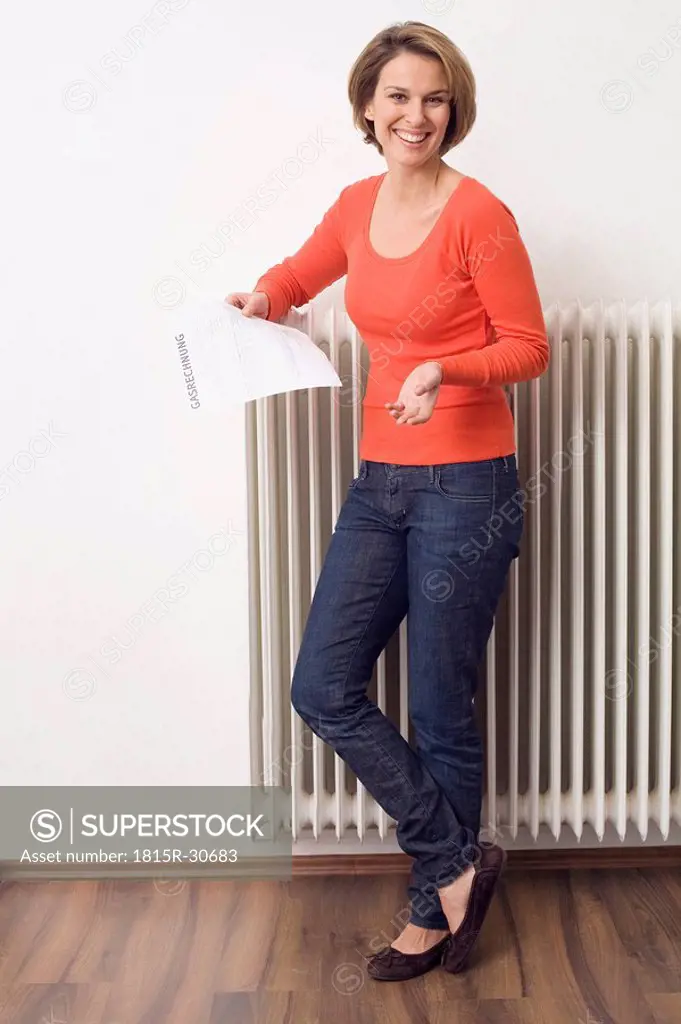 Woman holding utility bill