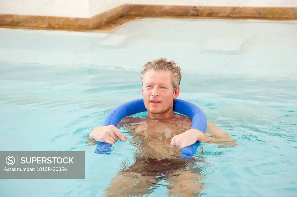 Man in swimmingpool, portrait