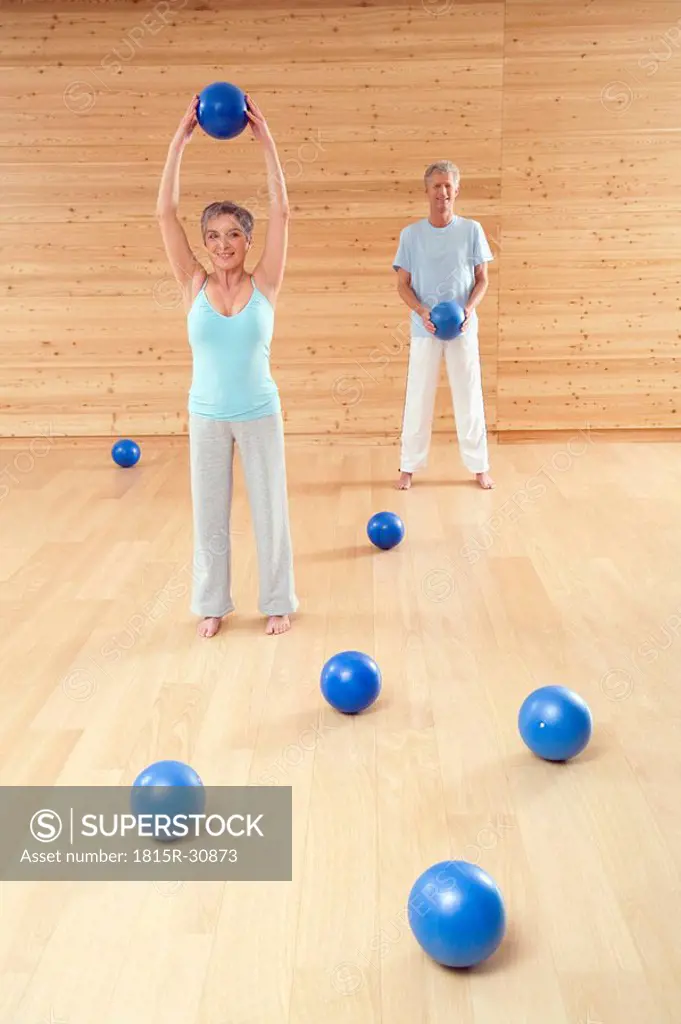 Mature couple with gymnastic ball