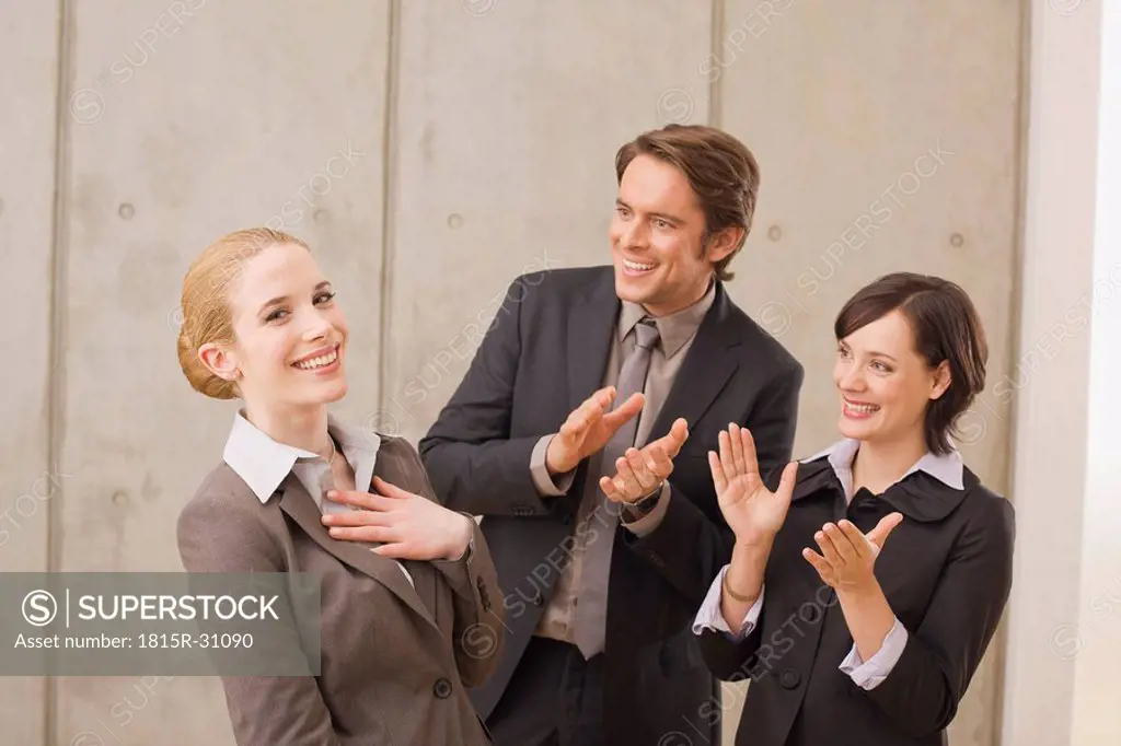 Business people in a meeting, applauding