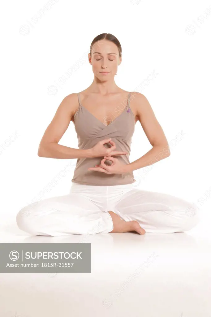 Woman doing 'Jhana Mudra Chin Mudra' yoga, eyes closed