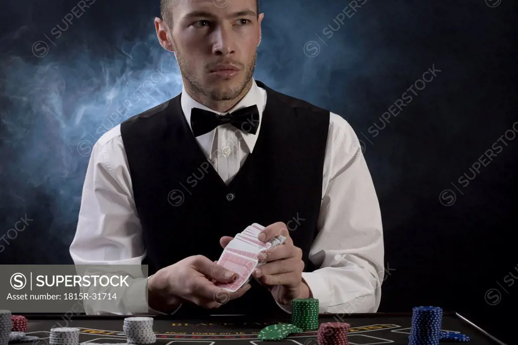 Man mixing playing cards