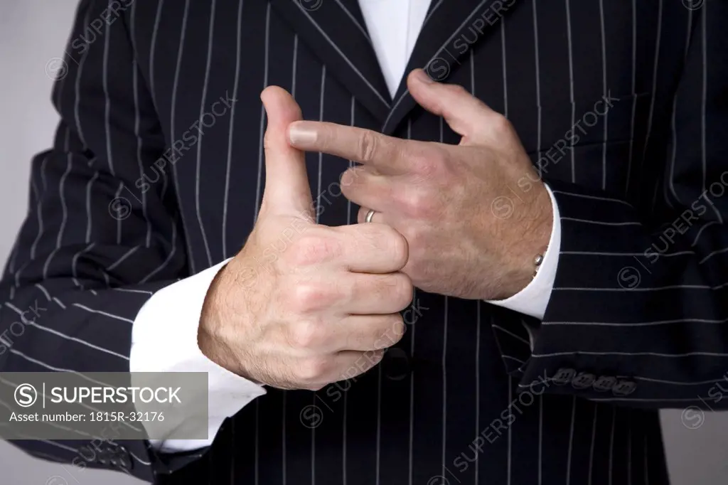 Man making hand gesture, counting, close-up