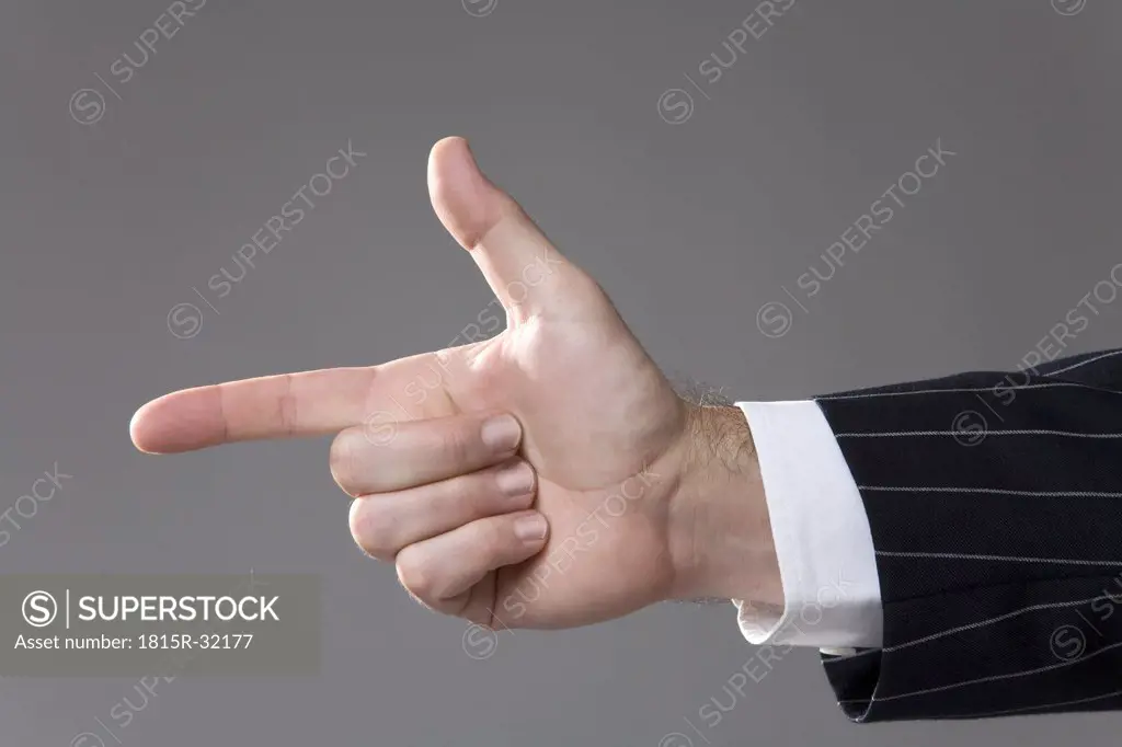 Man making hand gesture, pointing, close-up