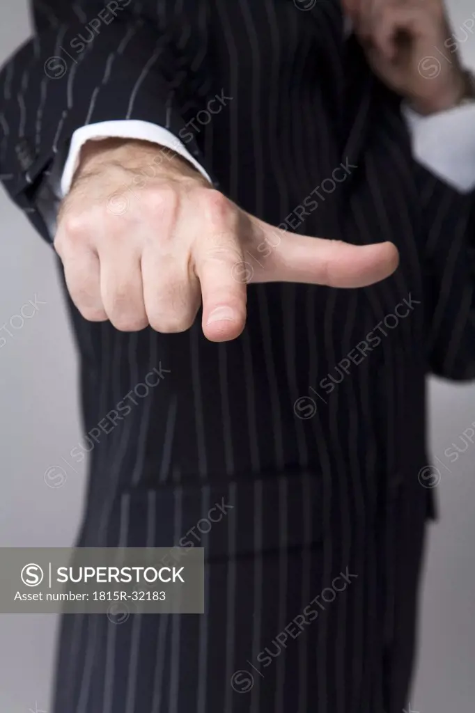 Man making hand gesture, pointing, close-up