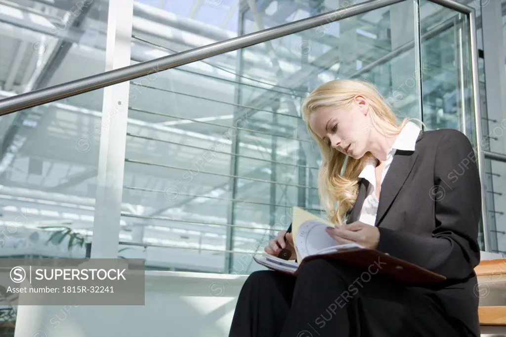 Business woman with diary, portrait