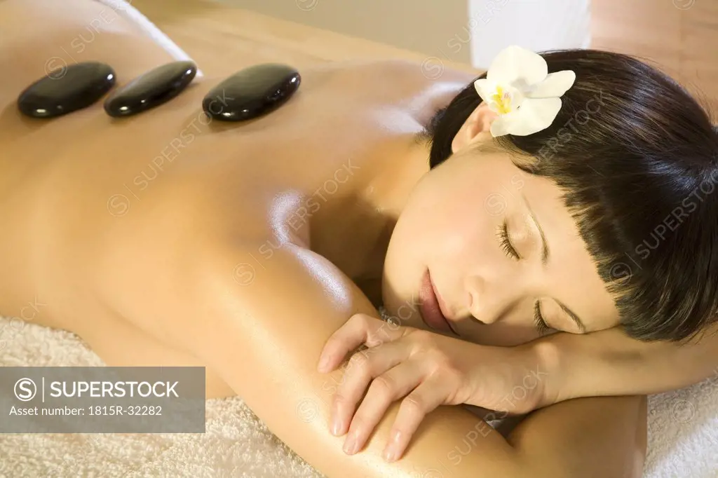 Young woman in spa, receiving lastone therapy