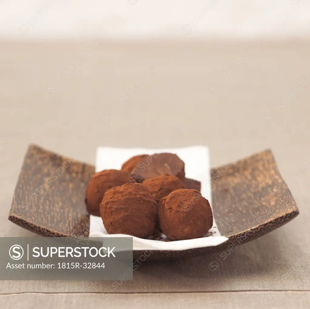 Chocolate truffles in bowl, close-up