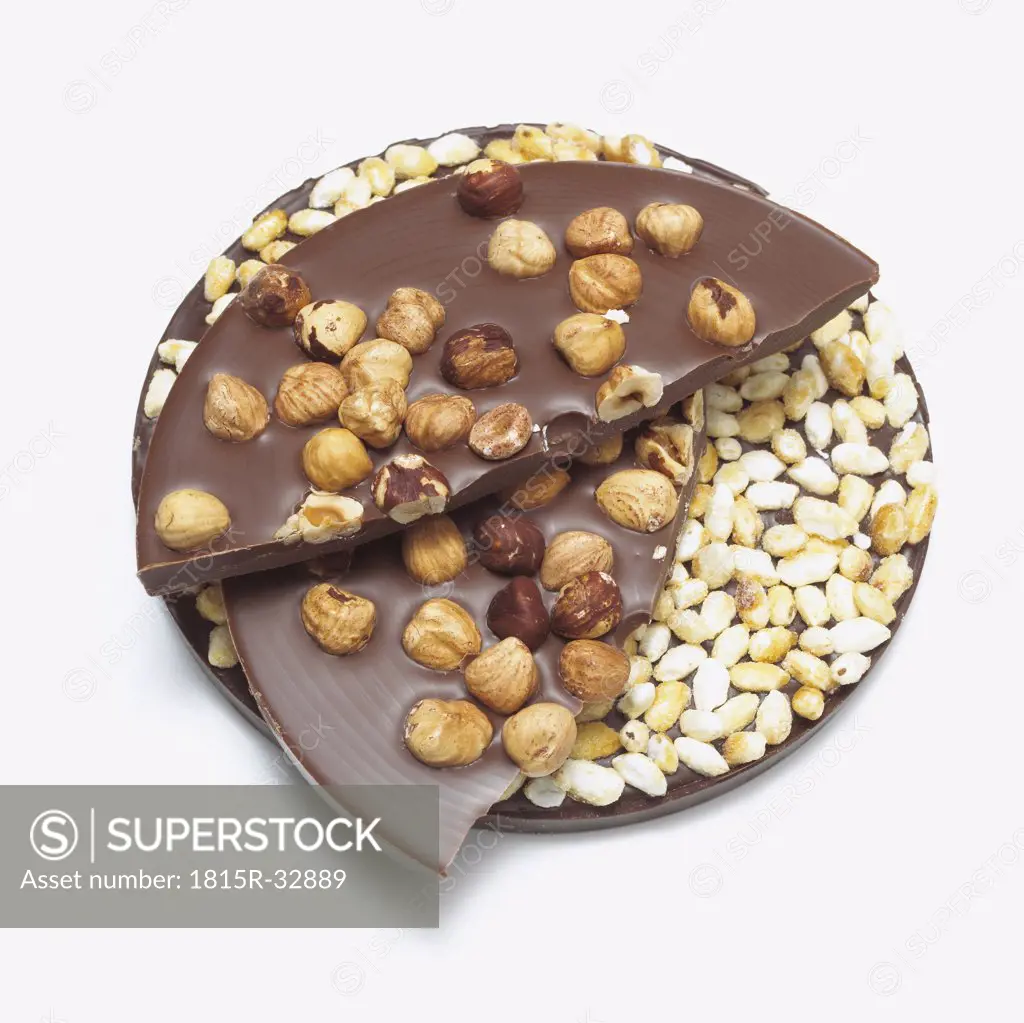 Chocolate with nuts and puffed rice, close-up