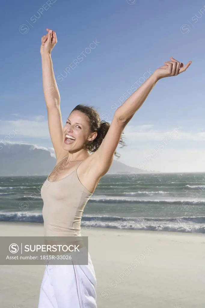 South Africa, Cape Town, Young woman cheering, portrait