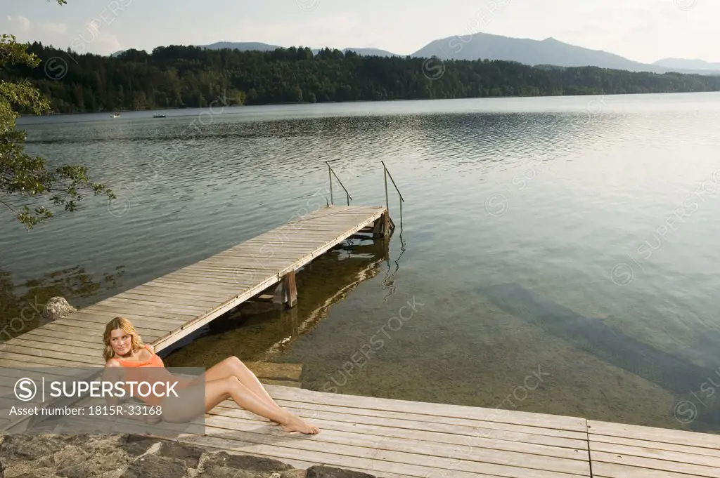 Woman relaxing on jetty