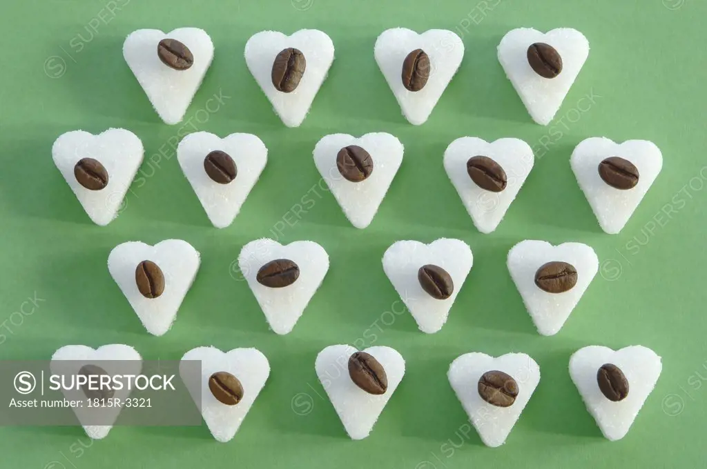 Coffee beans on sugar cubes, close-up