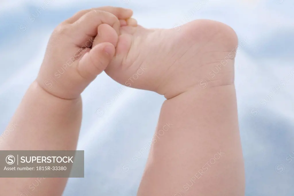 Baby's hand and baby`s foot (3-6 months), close-up