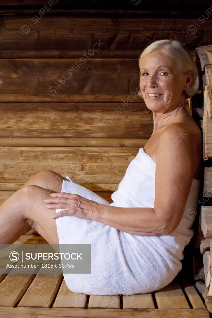 Germany, senior woman in sauna