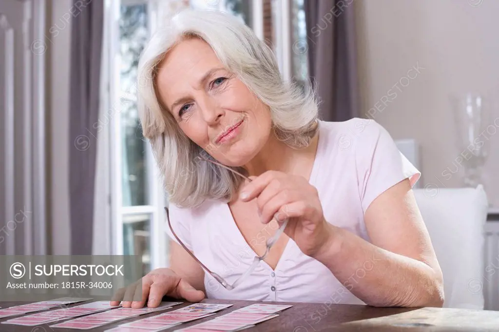 Senior woman playing Solitaire, portrait