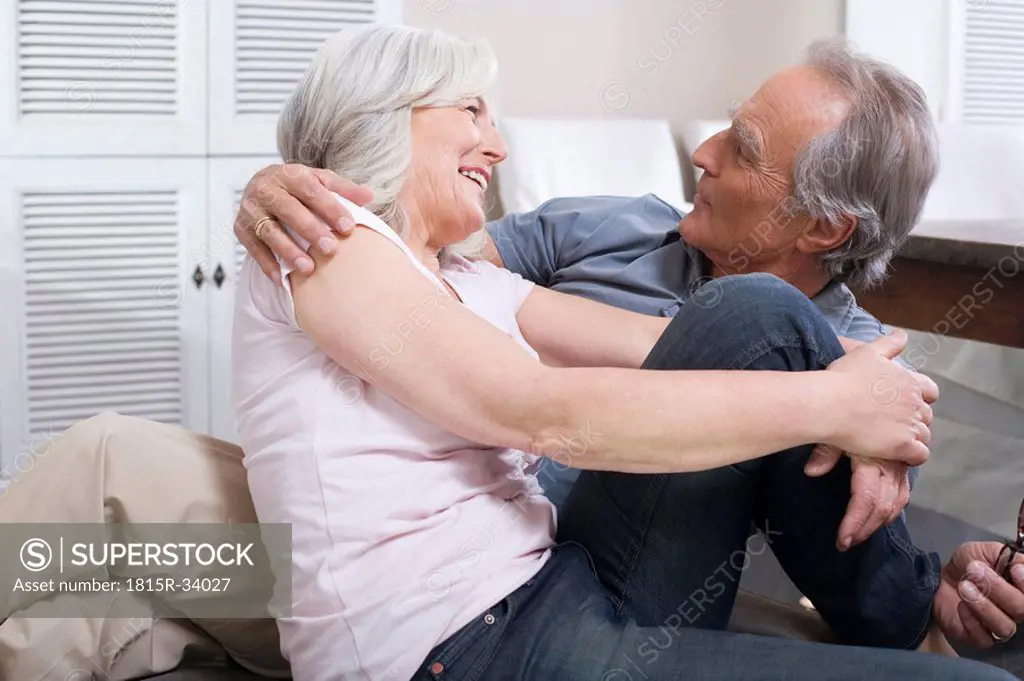 Senior couple embracing, portrait