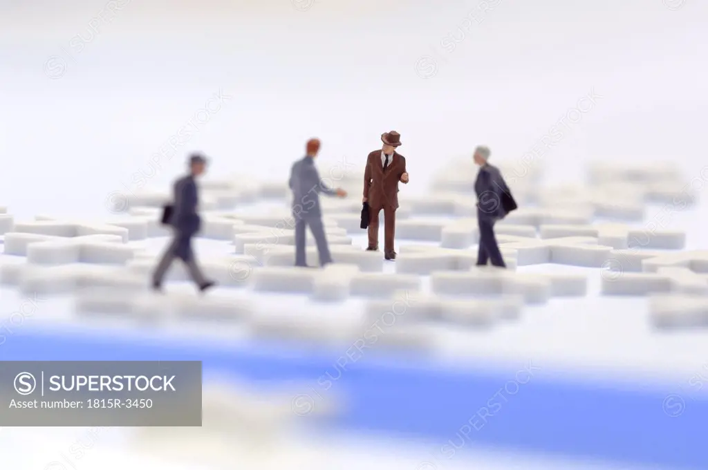 Business network, figurines on cross-shaped latic pieces
